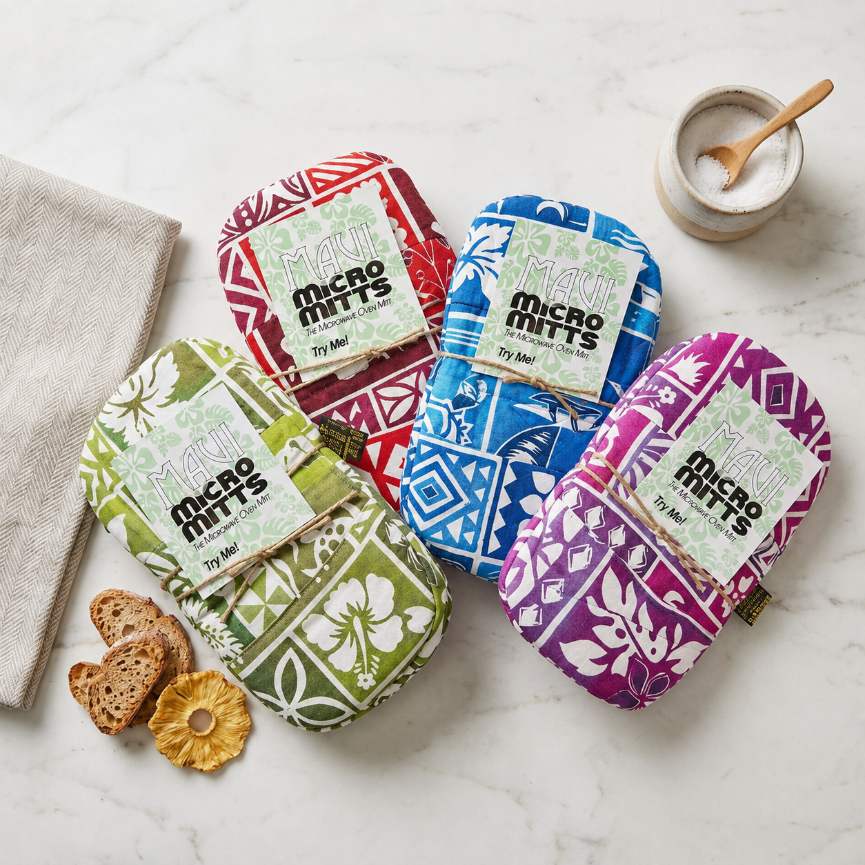 Maui Micro Mitts and kitchen essentials collection — handmade tropical mitts, potato pockets, luggage handle wraps, and towels shipped from the USA